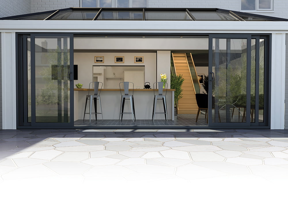 Aluminium conservatory with a sliding patio door
